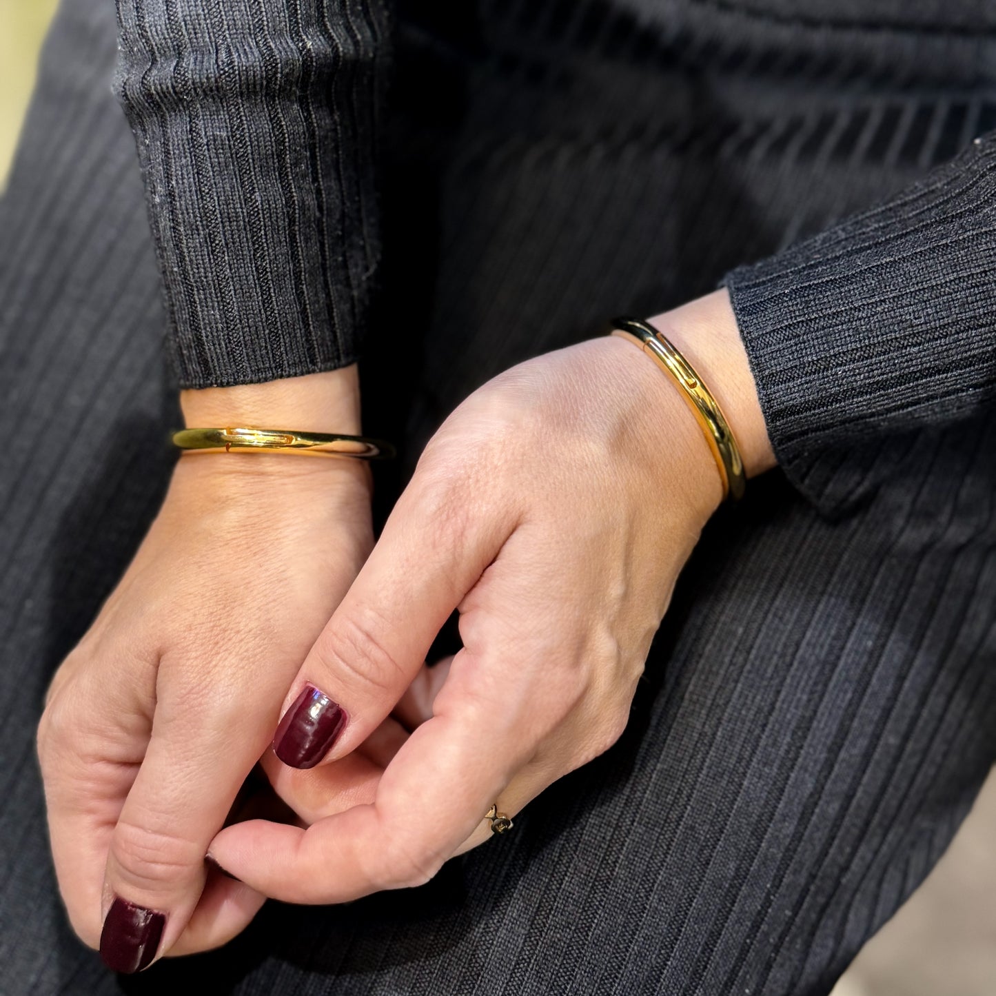 Thin locking jewelry bangles in black or polished gold with key
